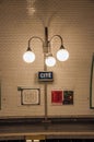 Close-up of luminaires in the Cite subway station platform in Paris.